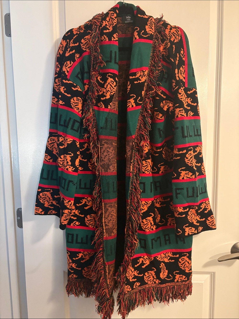 Dressed in LALA Black Sweater Coat with Green, Red & Orange Accents